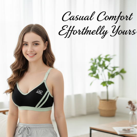 Woman wearing a sports bra and gray sweatpants in a living room setting with text 'Casual Comfort Efforthelly Yours'.